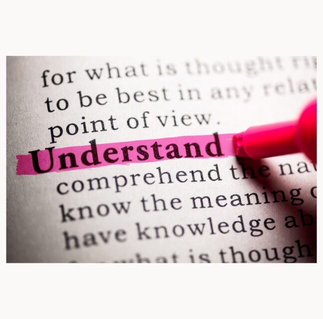 Dictionary page with the word understand highlighted in pink