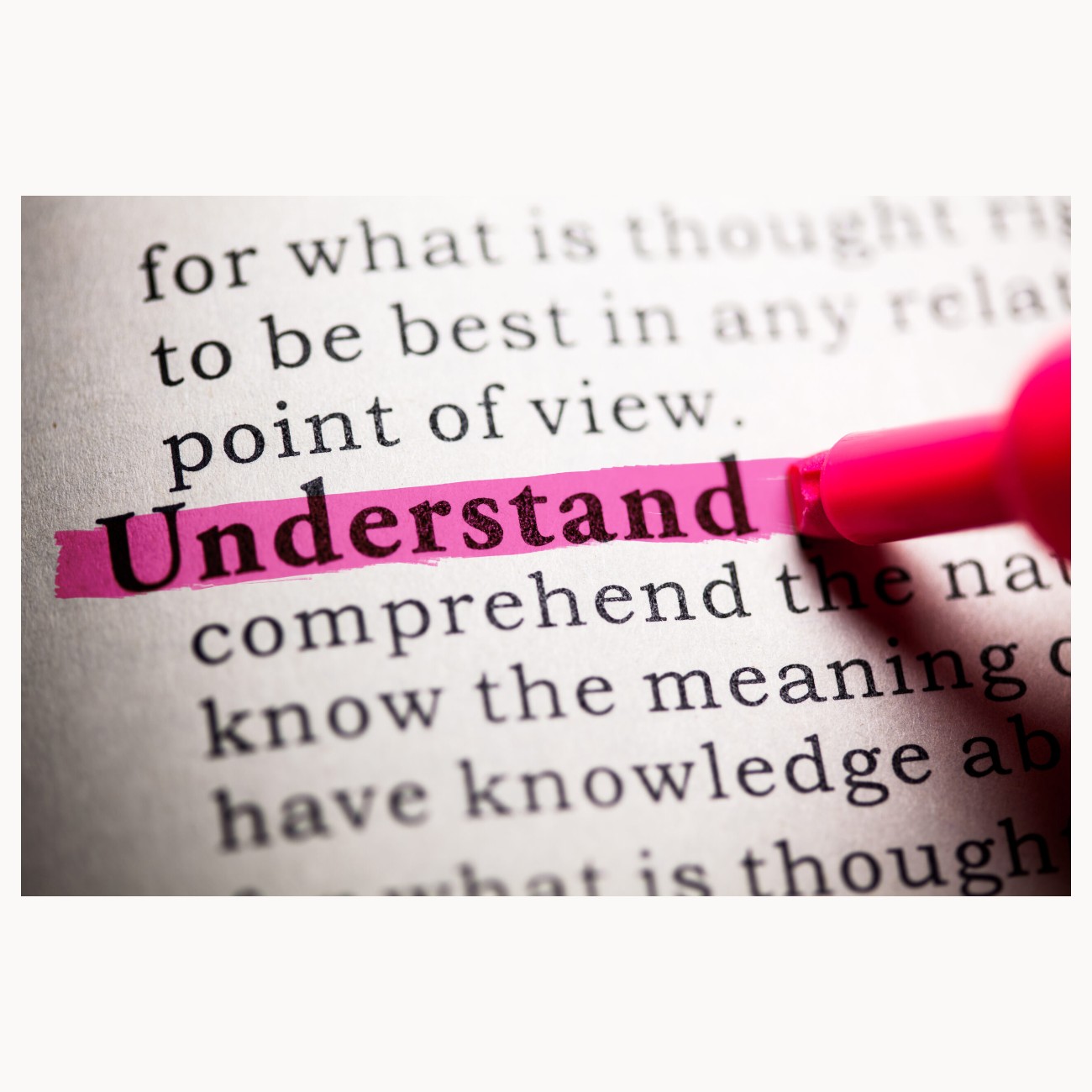 Dictionary page with the word understand highlighted in pink
