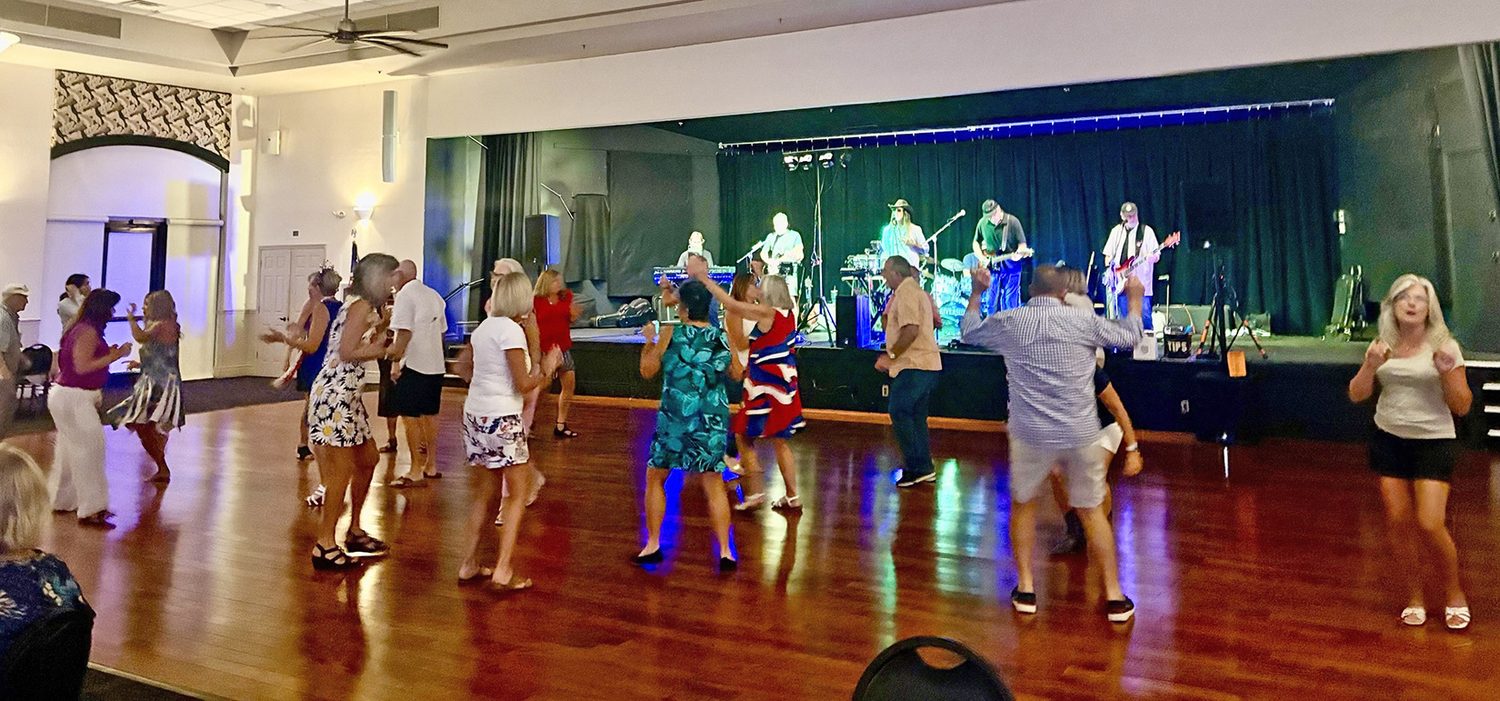 Herons Glen residents dancing to a live band in the ballroom