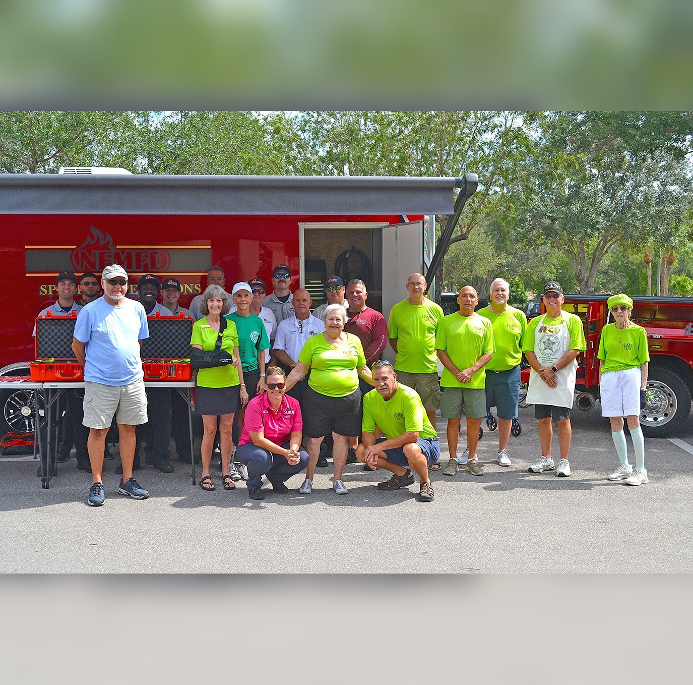 Volunteers and firefighters gathered in front of the Special Operations Trailer