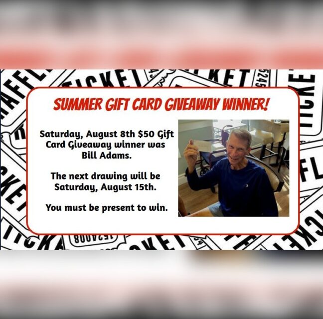 Bill Adams holding his August 8 gift card giveaway prize