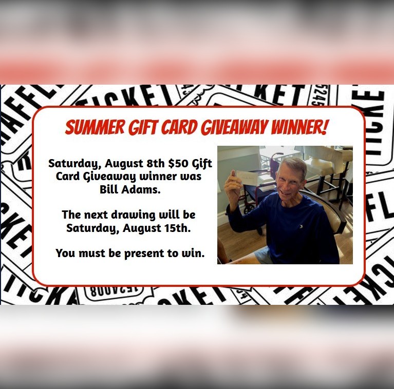 Bill Adams holding his August 8 gift card giveaway prize