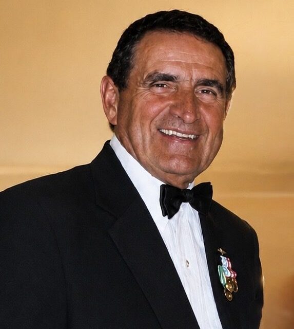 John Muskovac in a tuxedo wearing his Navy service medals