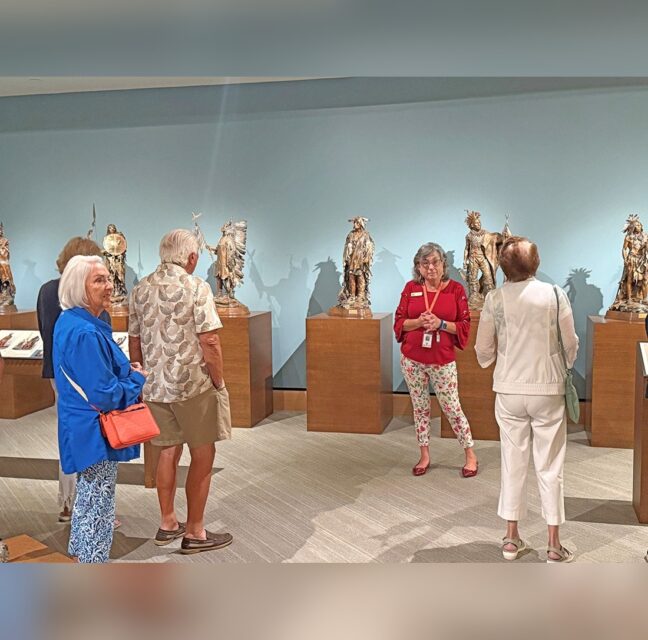 Travel Club members viewing sculptures at the James Museum