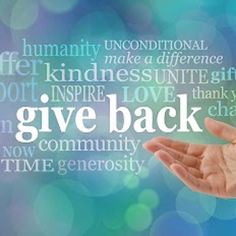 Open hand beside a word cloud reading give back, kindness, community and generosity